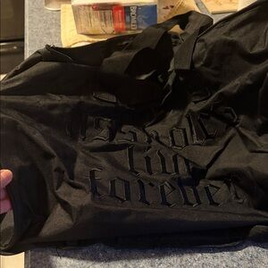 FIVE Brand new Assholes Live Forever duffle bags.